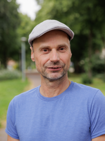 Das ist ein Porträtfoto von Tim Allrath